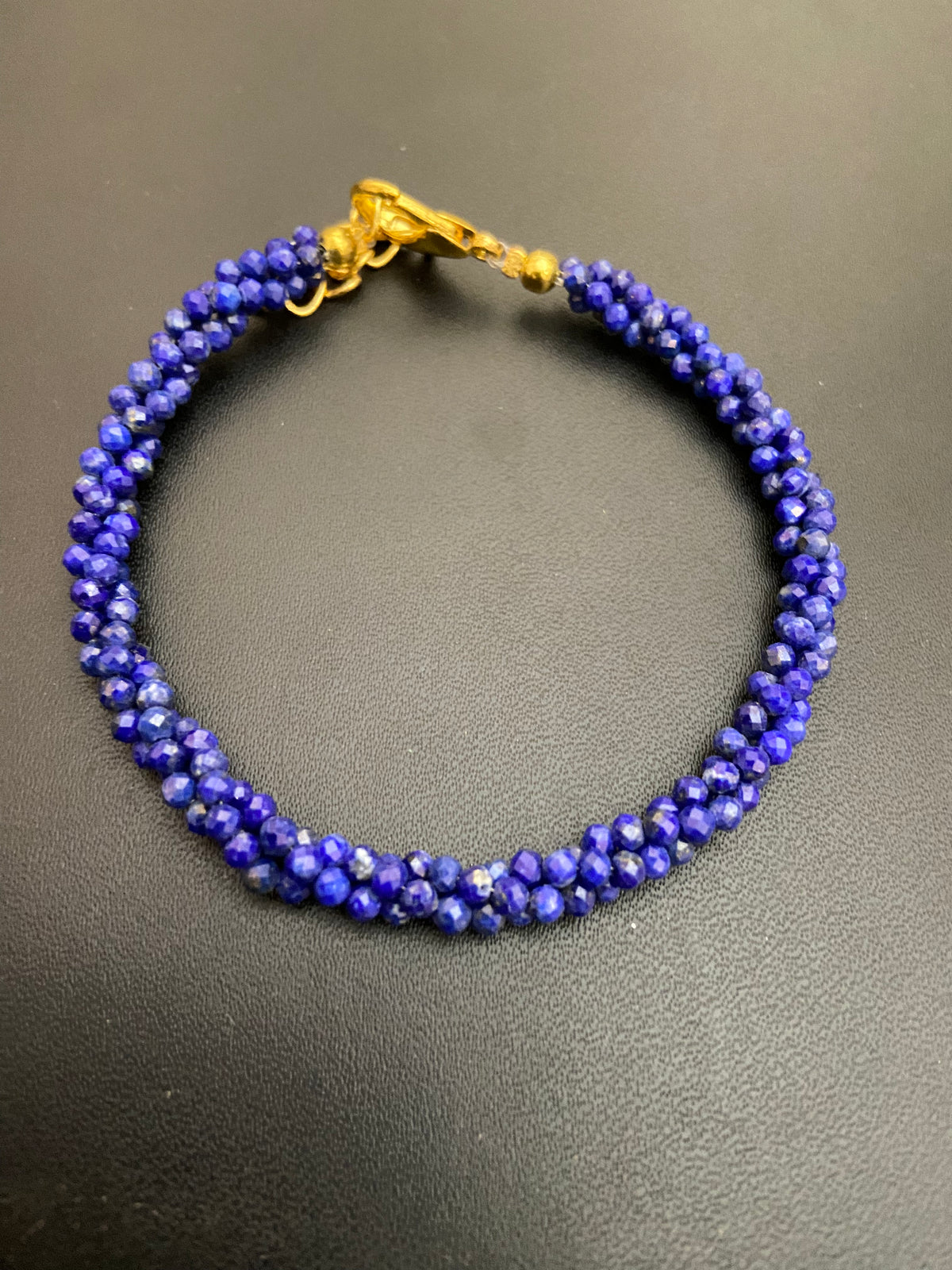 Handcrafted artisanal lapis lazuli beads twisted bracelets